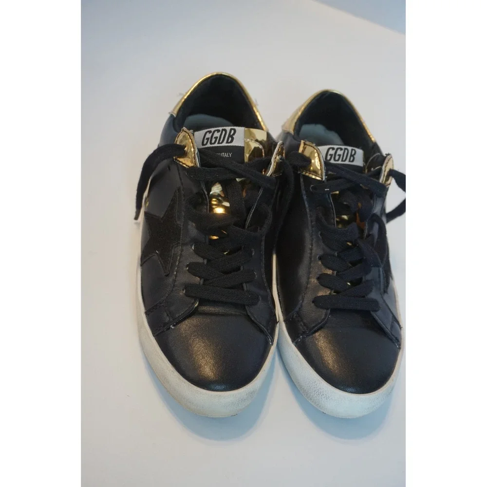 Black Star Low Top Sneakers with Gold Metallic Trim and Lace Up Front